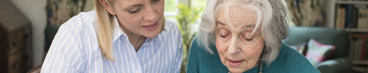 older adult and adult talking